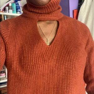 Rust orange cut out turtleneck sweater